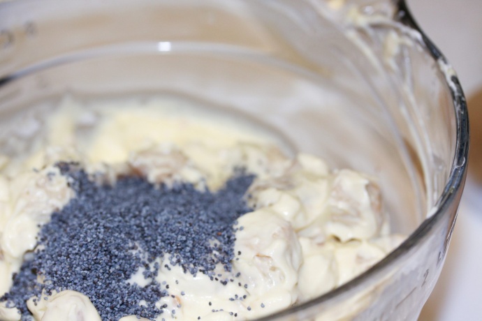 Creamy Poppy Seed Chicken Casserole Assembly - Chicken with sour cream and soup mixture with poppy seeds