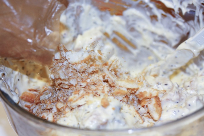 Creamy Poppy Seed Chicken Casserole Assembly - Chicken with sour cream and soup mixture with poppy seeds and crackers