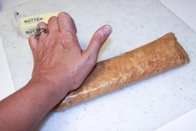 Crushing crackers in a wax paper sleeve