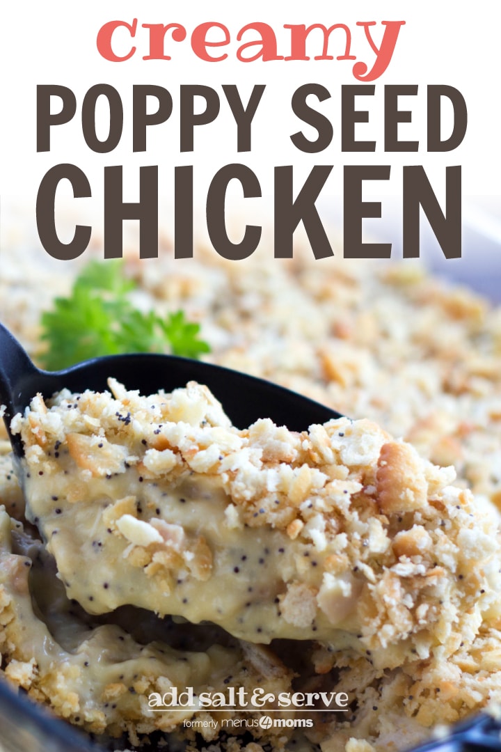 A black spoon is scooping Poppy Seed Chicken Casserole out of a clear glass casserole dish. 