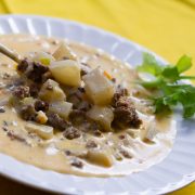 Easy Cheeseburger Soup with Velveeta Cheese and diced potatoes in a bowl.