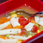 Red square soup bowl with homemade turkey noodle soup.