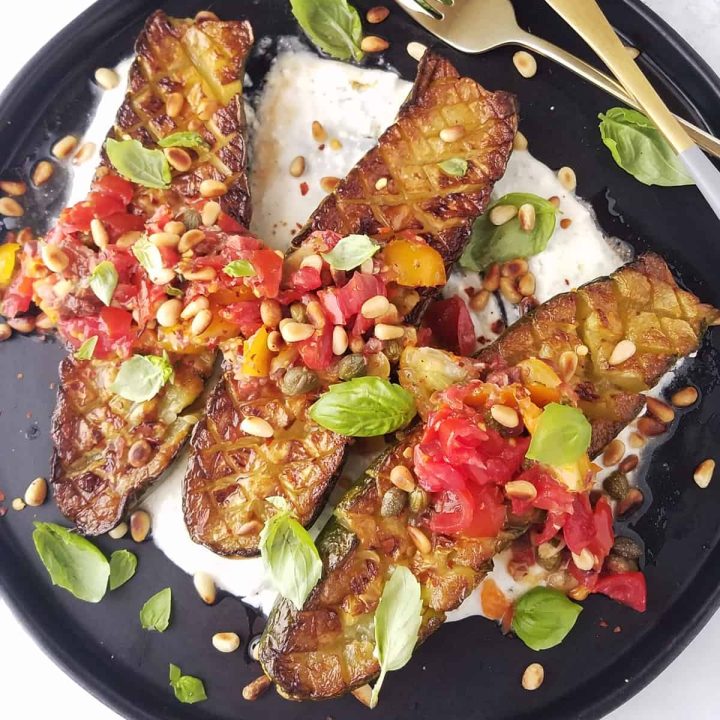 Thomas Keller fried zucchini topped with tomatoes, basil, and roasted pine nuts.
