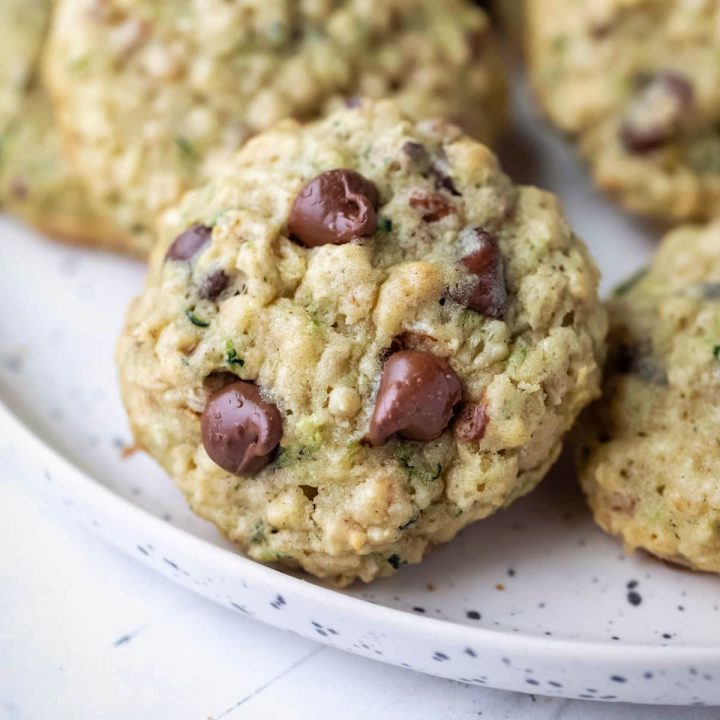 Zucchini chocolate chip cookies on a plate.