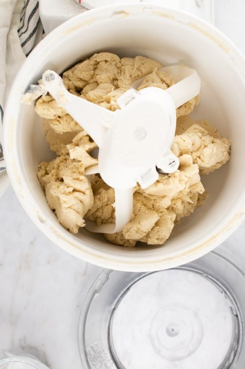 Overhead shot of pie crust dough in a mixer