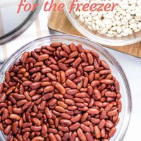 Overhead shot of bowl of dried kidney beans with a strainer and a bowl of great northern beans on a cutting board; text How to Cook Dried Beans for the Freezer Add Salt & Serve formerly Menus4Moms