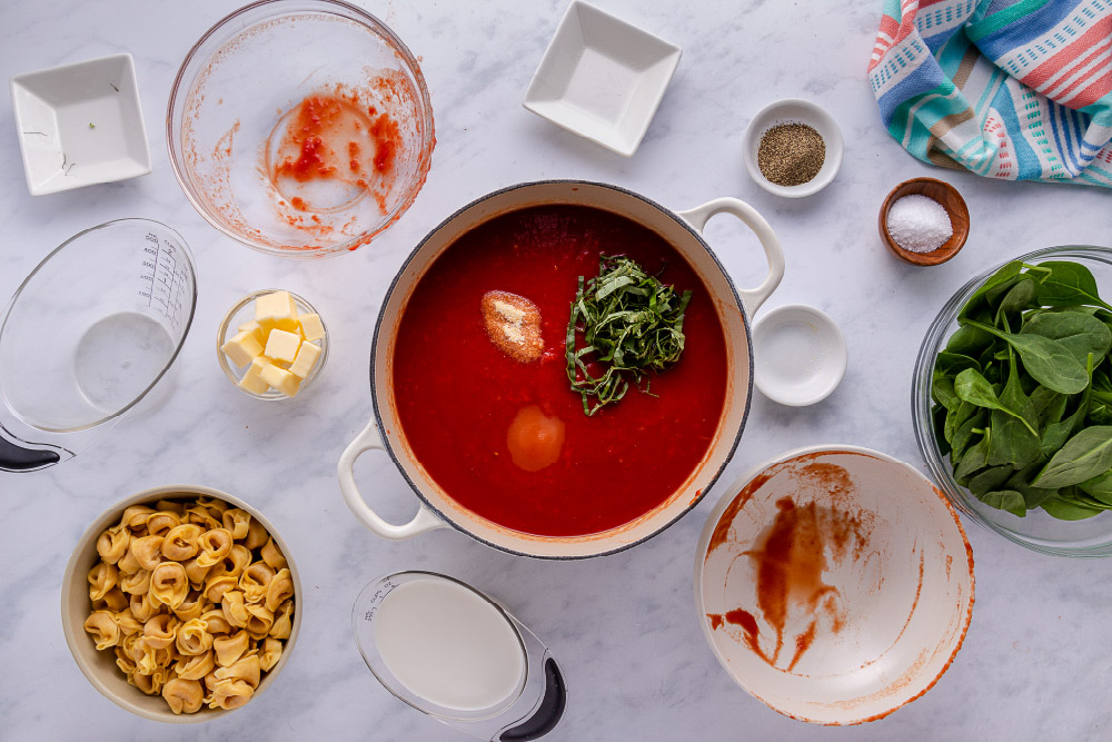 Adding basil to Tomato Spinach Tortellini Soup