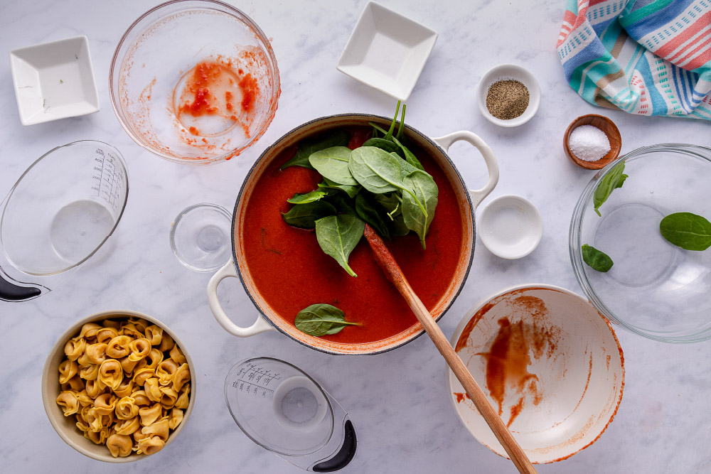 Adding spinach to Tomato Spinach Tortellini Soup