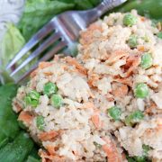 Veggie rice salad with chicken served on lettuce leaves