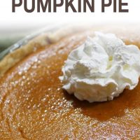 Baked pumpkin pie garnished with whipped cream and text Classic Pumpkin Pie (Add Salt & Serve logo)