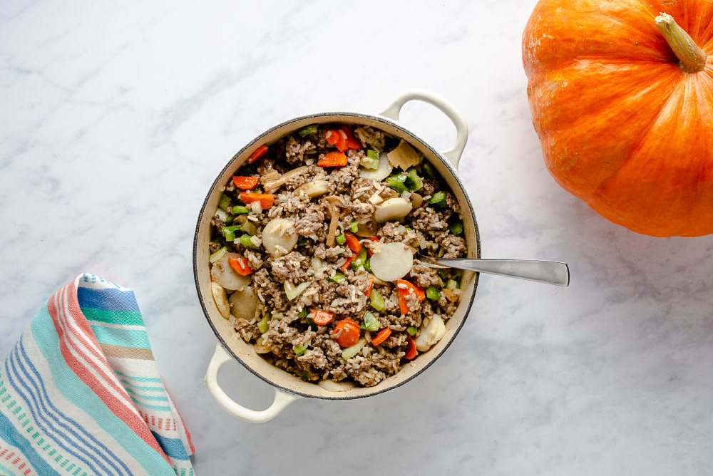ground beef and rice mixture for dinner in a pumpkin