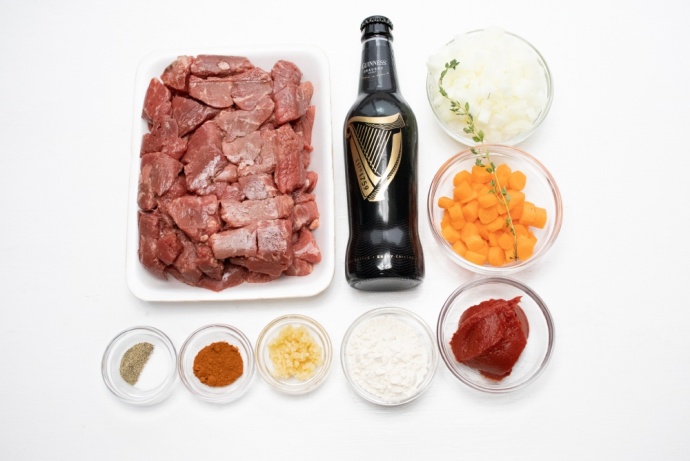 Ingredients: Beef stew meat, a bottle of guinness beer, chopped onion, chopped carrot, tomato paste, flour, minced garlic, paprika, thyme, salt, and pepper