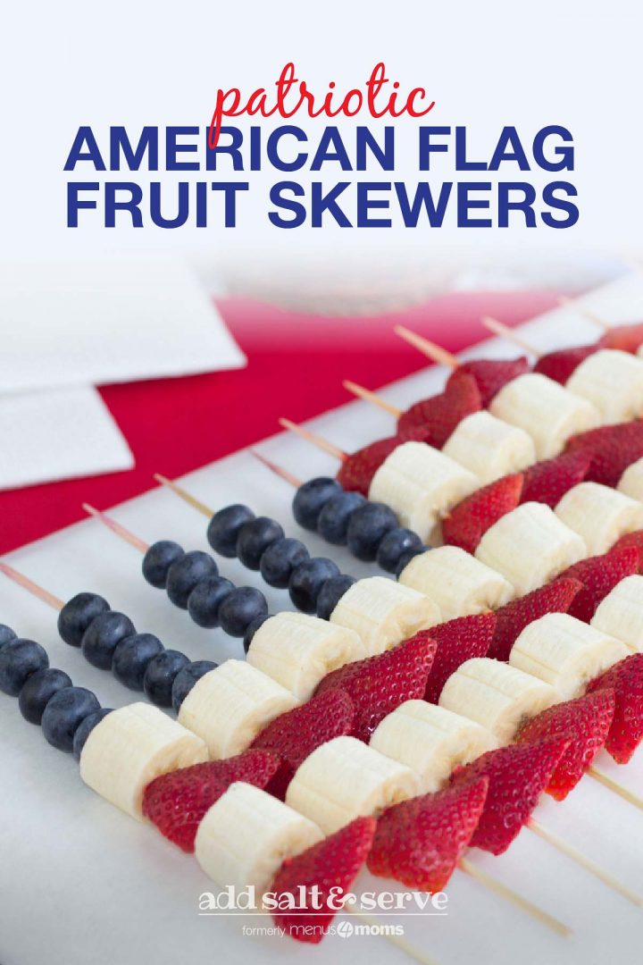 Blueberries, strawberries, and bananas threaded on bamboo skewers in the design of an American flag