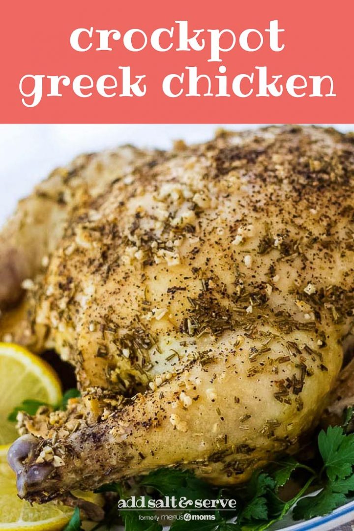 Whole roasted chicken with a dried rosemary and minced garlic rub on a white plate, garnished with lemon slices and parsley. Text Crockpot Greek Chicken Add Salt & Serve formerly menus4moms
