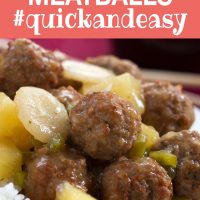 Meatballs, water chestnuts, and pineapple chunks in sauce over white rice, text Sweet and Sour Meatballs #quickandeasy