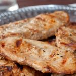 Grilled boneless skinless chicken breasts with a sesame marinade brushed on them and served on a Armetale platter
