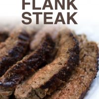 Seaasoned and grilled flank steak sliced and plated with juices and text Italian Flank Steak