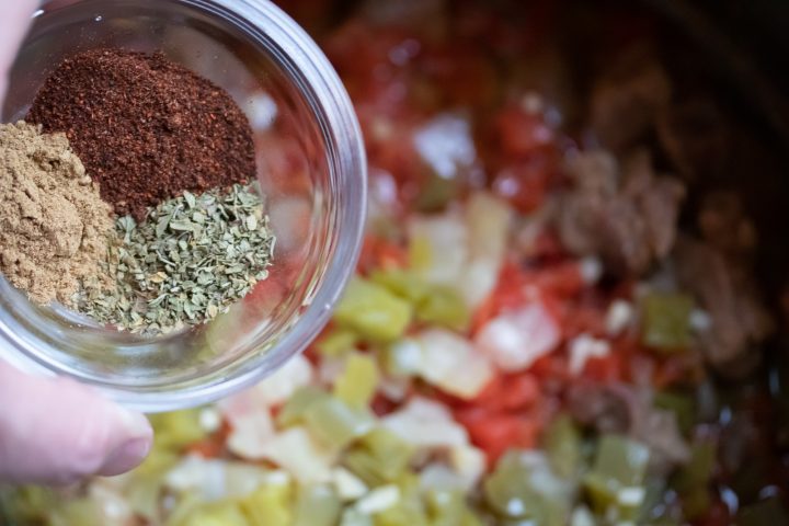 Carne Guisada: Add chili powder, oregano, and cumin to cooked beef