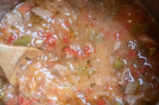 Carne Guisada: Add thickened juices to meat and stir to blend