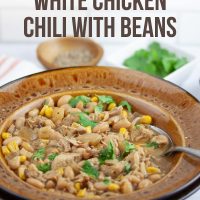 Slow Cooker White Chicken Chili with Beans Garnished with Cilantro - Add Salt & Serve