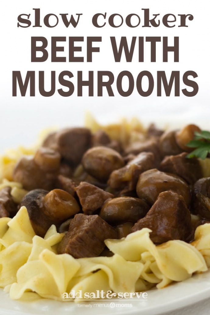 White plate with egg noodles topped with beef and mushrooms, garnished with a sprig of parsley; text slow cooker beef with mushrooms add salt & serve formerly menus4moms