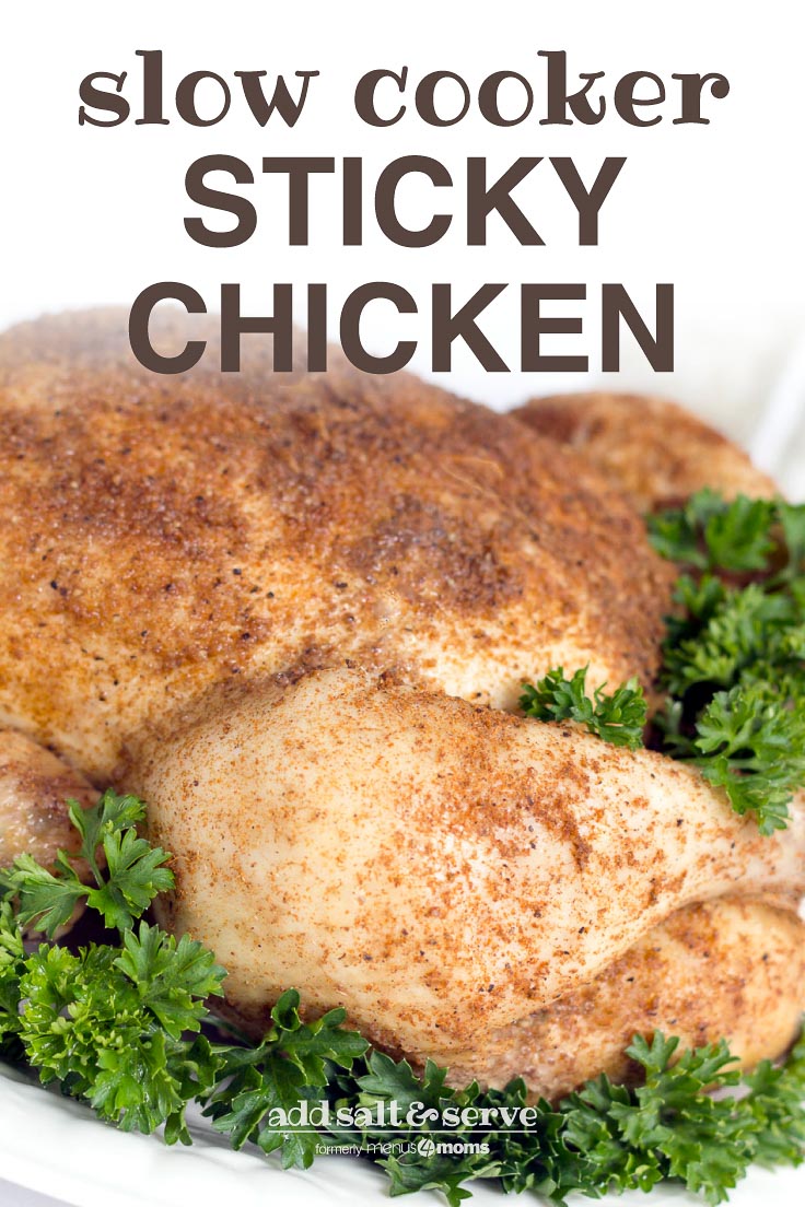 Whole cooked chicken covered with spices, on a white plate garnished with a lot of parsley. Text Slow Cooker Sticky Chicken Add Salt & Serve formerly menus4moms