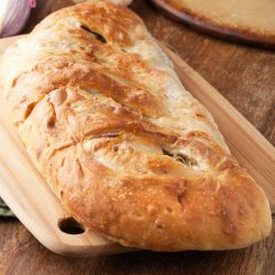 Vegetable Stromboli on a cutting board.
