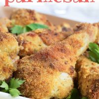 Breaded baked Chicken Parmesan drumsticks garnished with parsley