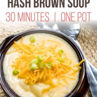 Overhead shot of a bowl of Hash Brown Potato Soup topped with shredded cheddar cheese and garnished with diced green onions. Text is Stovetop Hash Brown Soup 30 Minutes | One Pot - Add Salt & Serve logo