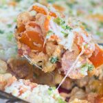 Casserole with pasta, kielbasa, sliced carrots, green onions, and cheese