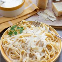 Homemade Alfredo sauce over fettuccine