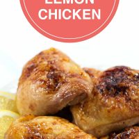 Four pieces of baked chicken on a white plate with lemon slices; text Baked Honey & Lemon Chicken - Add Salt & Serve logo