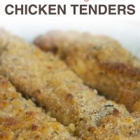 Three breaded chicken tenders on white plate