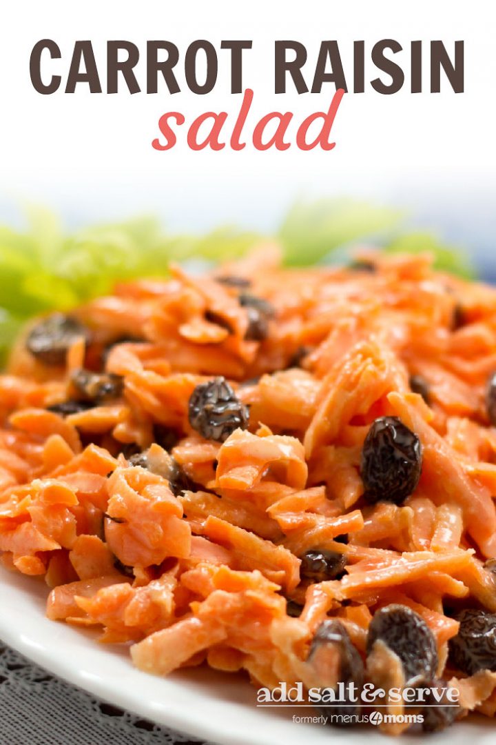 Carrot Raisin Salad on a white plate garnished with celery leaves and text Carrot Raisin Salad Add Salt & Serve