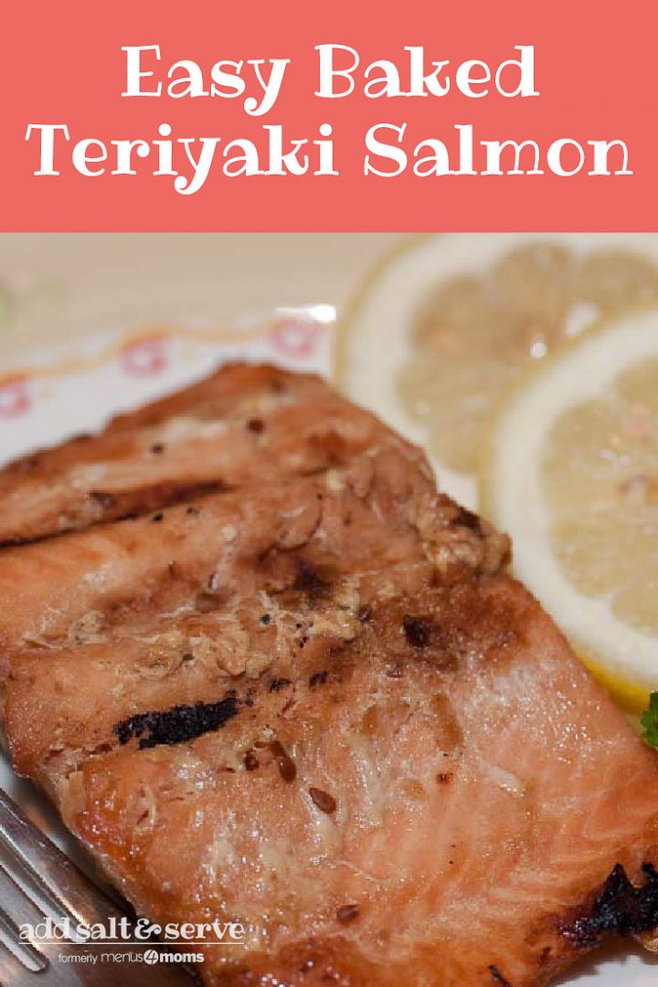 Pieces of cooked salmon on a white plate with a fork, garnished with two lemon slices. Text Easy Baked Teriyaki Salmon Add Salt & Serve formerly Menus4Moms