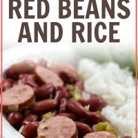 Slices of smoked sausage mixed with red beans, diced onions, and diced green bell pepper, beside a serving of rice. The food is in a white bowl with a fork and garnished with a sprig of parsley. Text Red Beans and Rice Add Salt & Serve formerly Menus4Moms