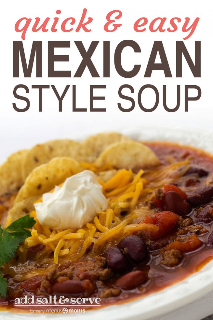 White bowl filled with soup of beans, tomatoes, and beef, topped with shredded cheddar cheese, tortilla chips, and sour cream, garnished with cilantro; text quick and easy mexican style soup Add Salt & Serve formerly Menus4Moms