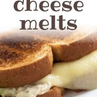 Tuna and a slice of melted swiss cheese on two pieces of toasted bread on a white plate; text tuna cheese melts add salt & serve formerly menus4moms
