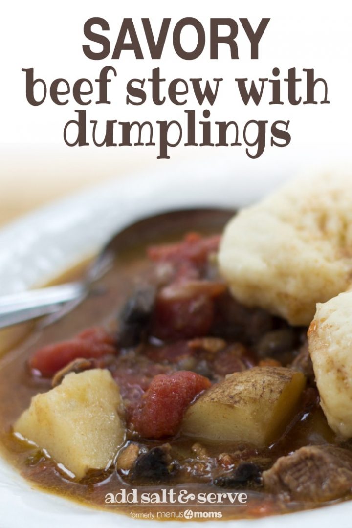 White bowl of beef stew with two dumplings on top. Stew consists of brown broth, diced beef, chopped potatoes, and stewed tomatoes. There is a spoon in the bowl on the left side. Text savory beef stew with dumplings add salt&serve, formerly menus4moms.