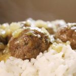 Meatballs with bits of pineapple served over white rice