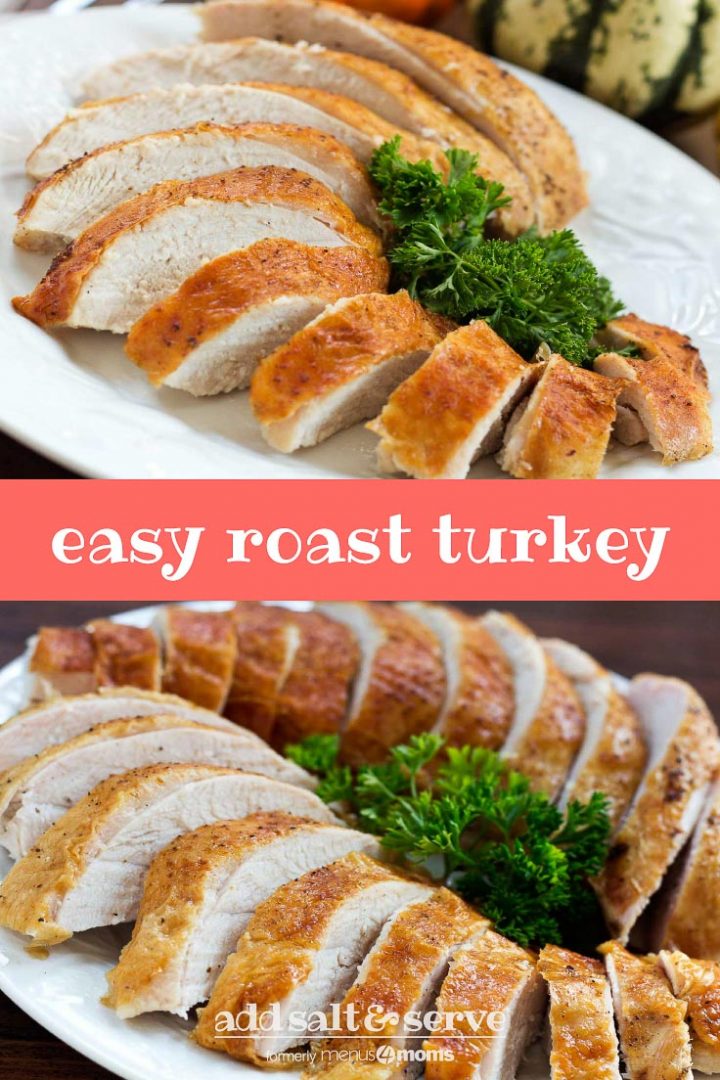 Sliced roasted turkey breast with golden brown skin on a white plate garnished with parsley