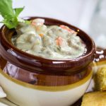 Crockpot Creamy Bratwurst Stew in a brown and white soup bowl.
