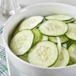 Cucumber and onion salad in a bowl.