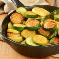 Sautéed yellow squash and zucchini in a cast iron skillet.