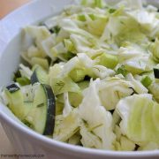 A bowl of cucumber and cabbage salad
