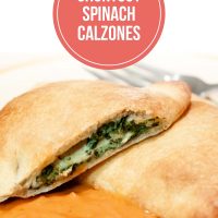 Spinach calzones on a plate with spaghetti sauce; text is Shortcut Spinach Calzones - Add Salt & Serve logo