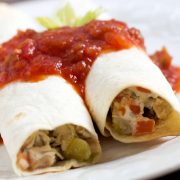 Two Tex Mex Chicken Roll Ups topped with salsa