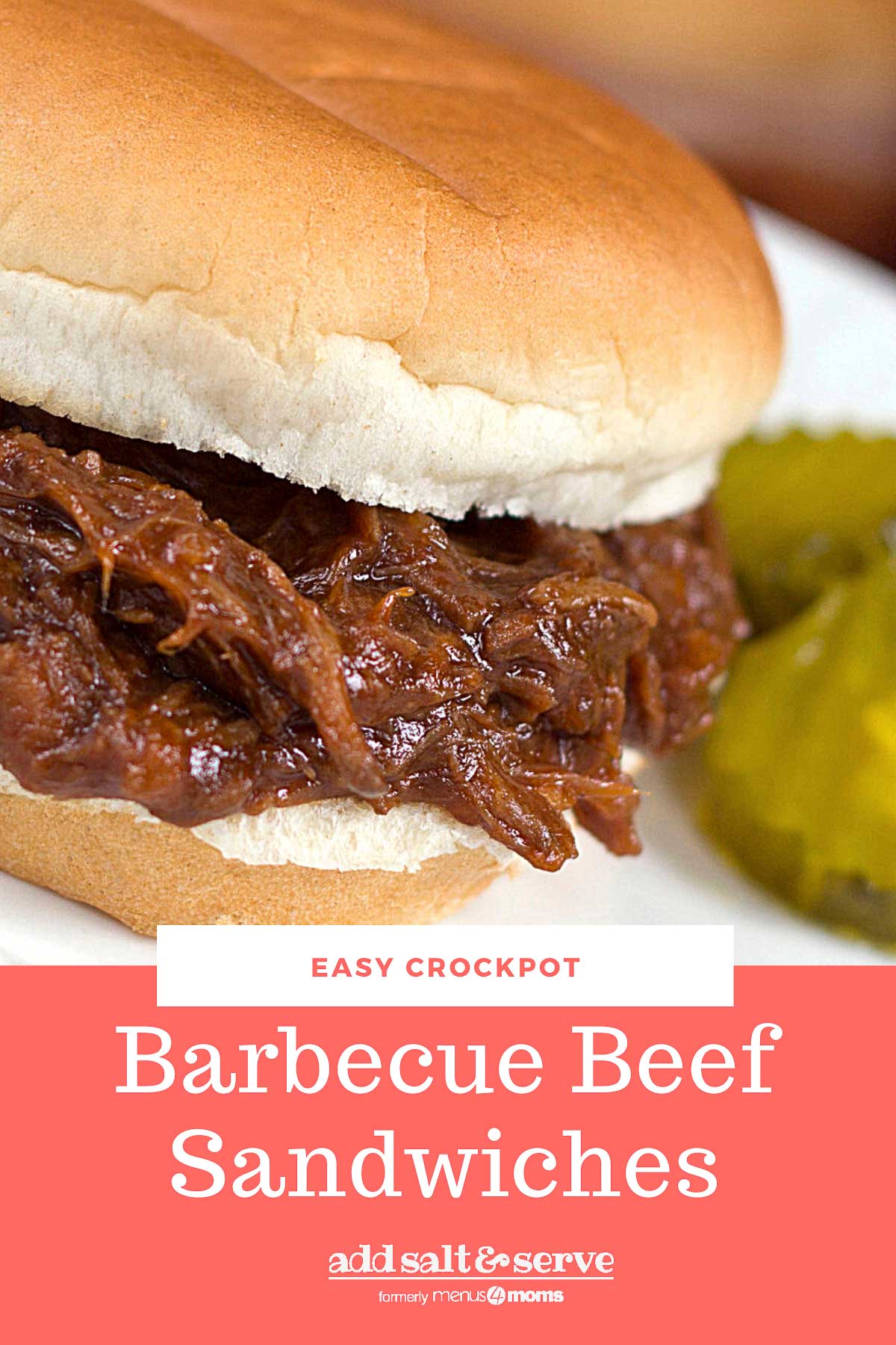 Barbecue Roast Beef Sandwich garnished with two pickle slices.