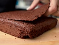 depiction of cutting off the rounded top of a cake