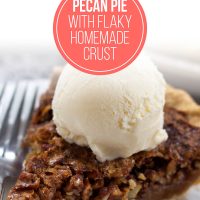 Homemade pecan pie topped with a scoop of vanilla ice cream
